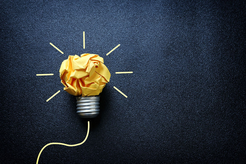 a lightbulb, with e bulb being crumpled paper, lit up.